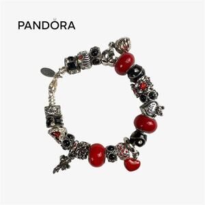 Silver charm bracelet filled with love themed red and Valentine’s Day charms